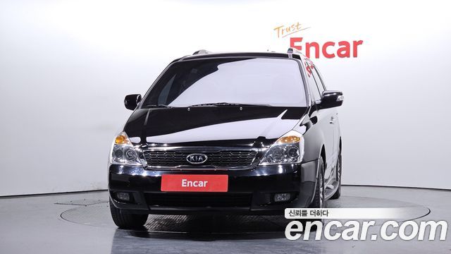 Kia Canival 2010 — photo 3