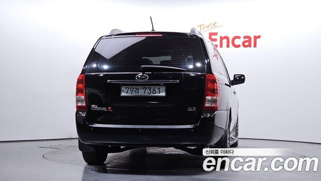 Kia Canival 2010 — photo 4