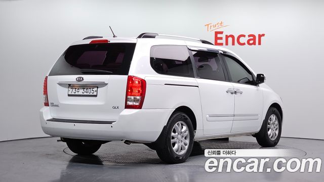 Kia Canival 2012 — photo 2