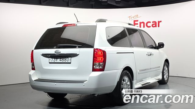 Kia Canival 2013 — photo 2