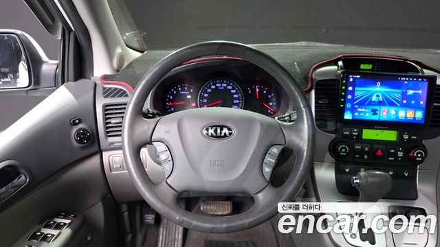 Kia Canival 2013 — photo 13
