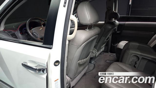 Kia Canival 2013 — photo 20