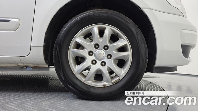 Kia Canival 2012 — photo 7