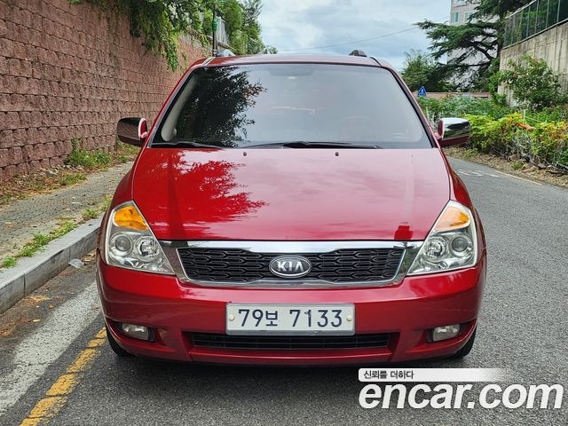Kia Canival 2010 — photo 2