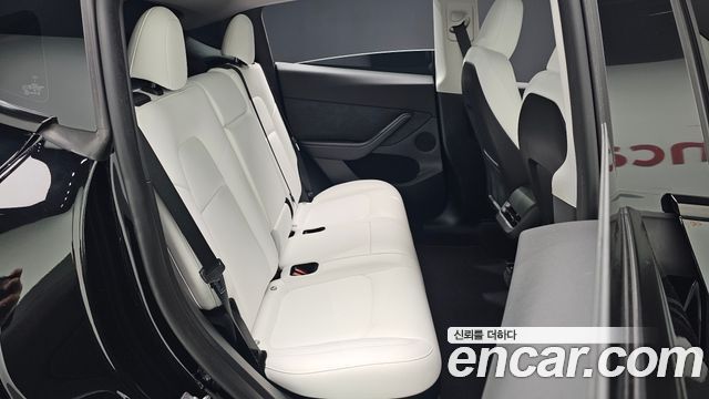 Tesla Model Y 2024 — photo 17