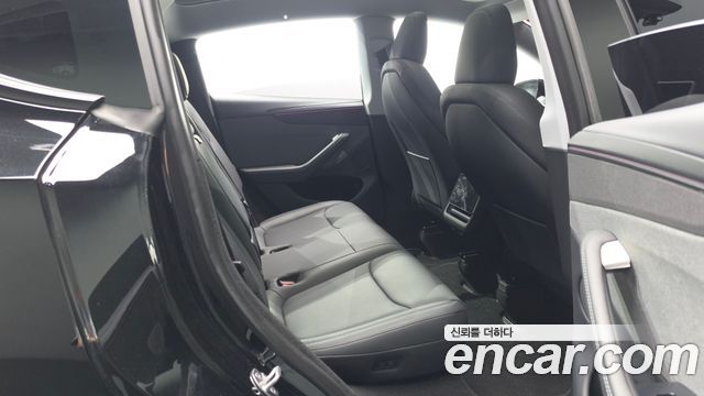Tesla Model Y 2025 — photo 18