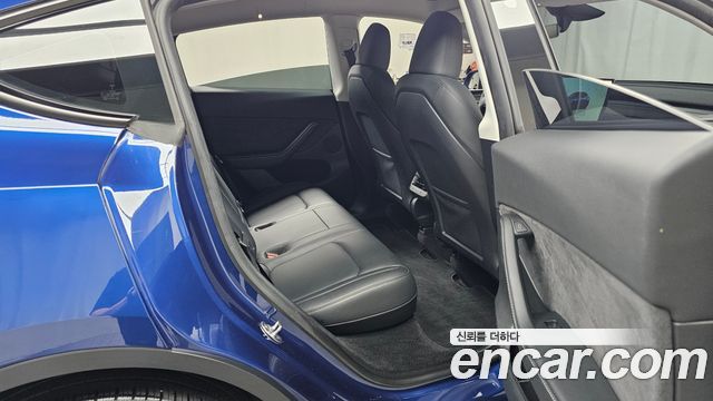 Tesla Model Y 2025 — photo 17