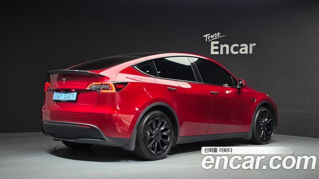 Tesla Model Y 2024 — photo 2